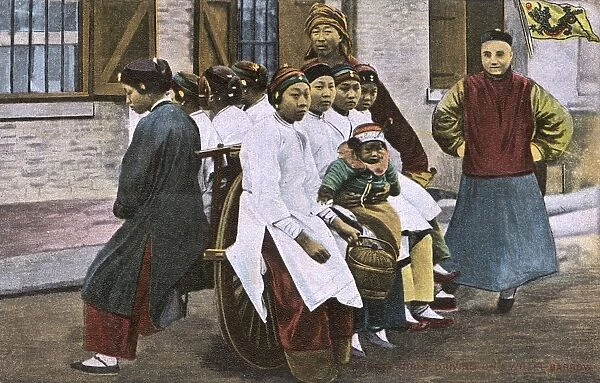 Eight Chinese Factory Girls on a wheelbarrow, China