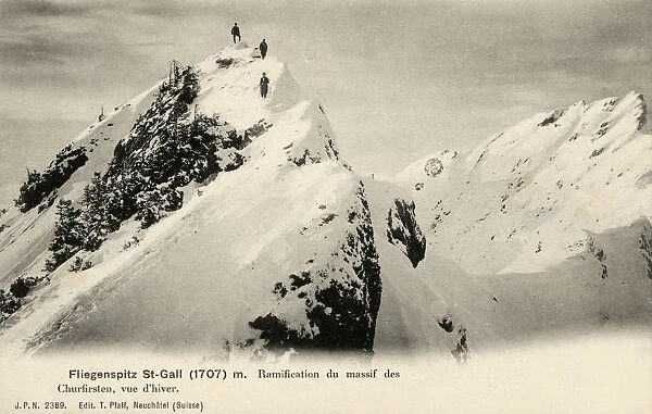 Climbers at the peak of a mountain in the Churfirsten range