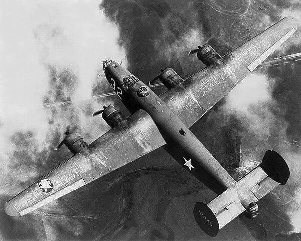 Consolidated B-24D (aft) aloft from hard above of 32