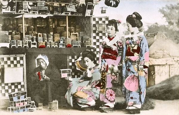 A decorative box seller and three geisha customers - Japan