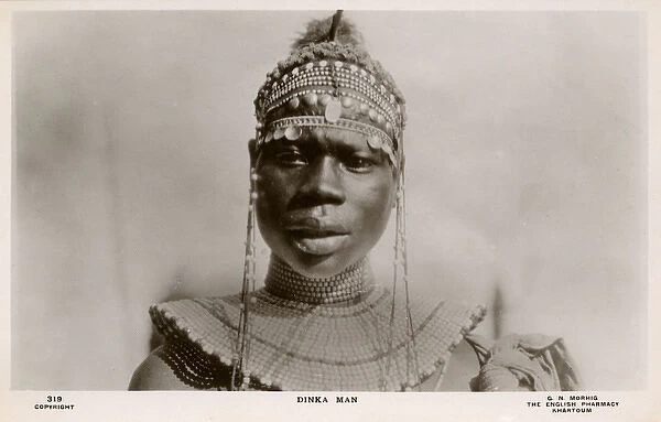 Dinka Man with elaborate head and neck decoration - Sudan