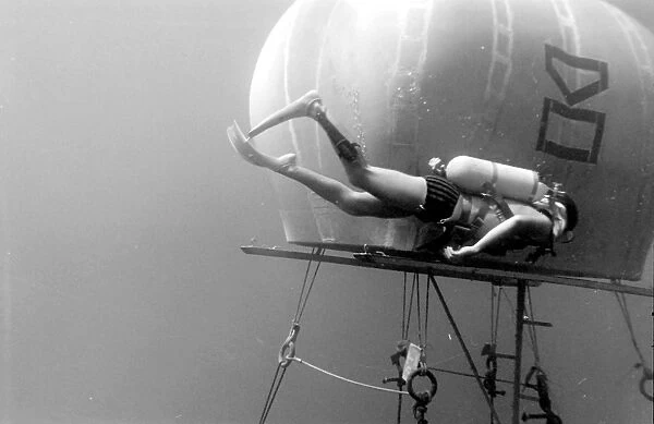 Diver with underwater house off the coast of Malta
