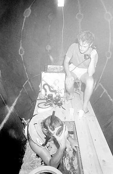 Divers inside underwater house off the coast of Malta
