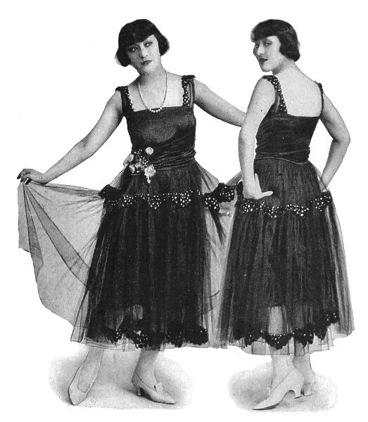 The Dolly Sisters modelling smart evening gowns