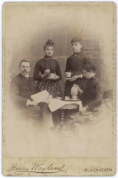 Edwardian family at the coffee table