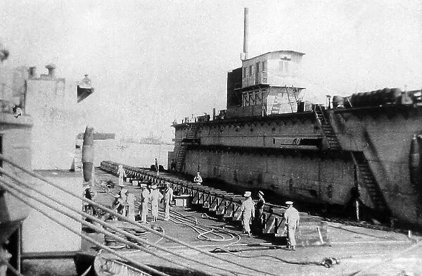 Egypt Port Said HMS Implacable alongside a captured
