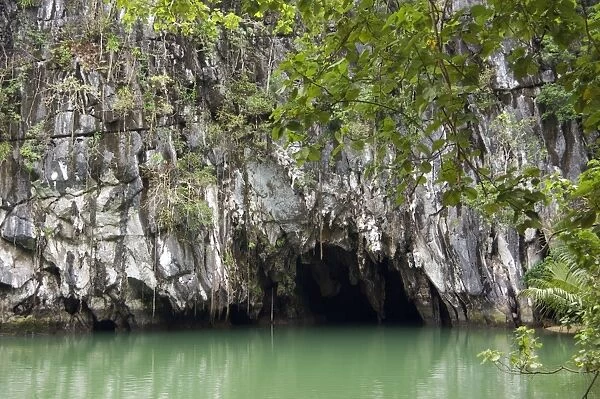 Entry to a cave that features a limestone karst