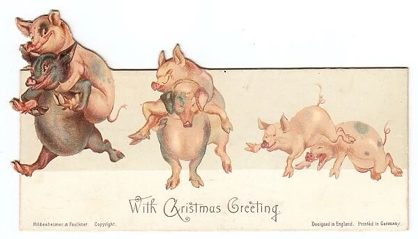 Six frolicking pigs on a Christmas card