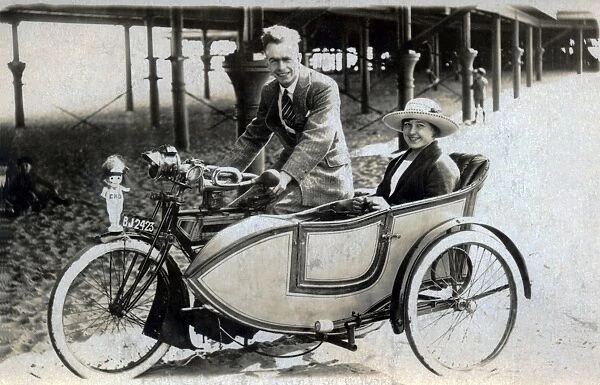 Gentleman & lady on a 1914 Triumph motorcyle & sidecar
