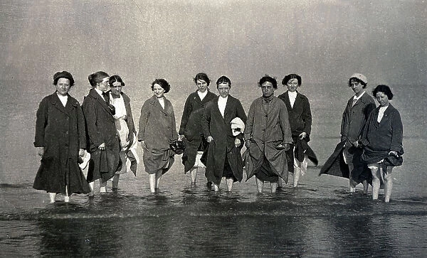 Group of women paddling in the sea