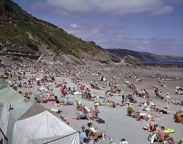 Holidaymakers on the beach at Looe, Cornwall