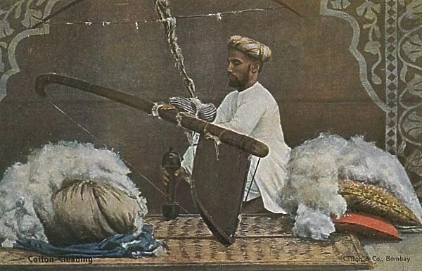 Indian man cleaning cotton