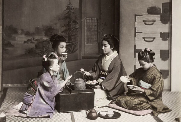 Japan: girls drinking tea with a kettle and stove