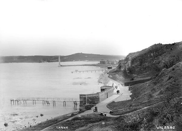 Larne - an elevated view looking down on the coastal walk with the bathing piers