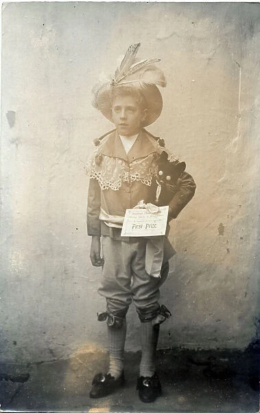 A little boy called Rob poses for a photograph wearing a first prize-winning costume