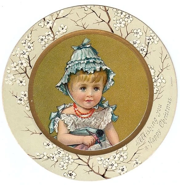 Little girl in a blue bonnet on a circular Christmas card