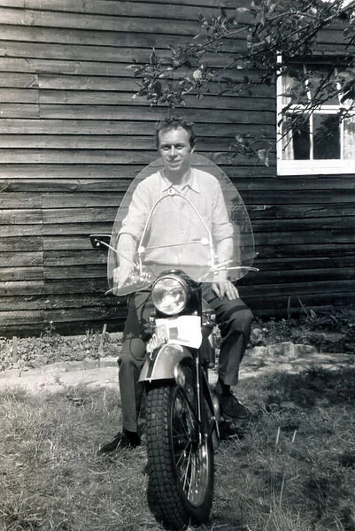 Man on 1950s Triumph motorcycle