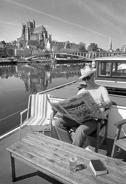 Man on houseboat, Auxerre sur Yonne, France