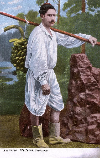 Man in traditional costume, carrying bananas, Madeira