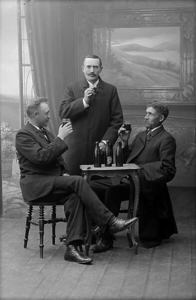 Three men drinking