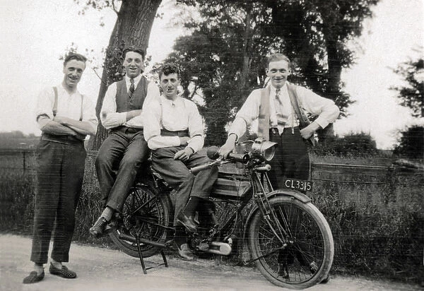 Men pose with 1914  /  15 Triumph motorcycle