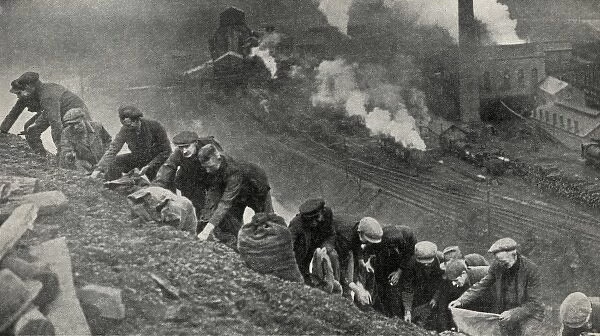 Men searching for coal on slag heap
