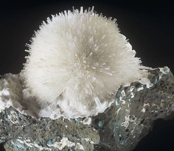 Mesolite is comprised of (hydrated sodium calcium aluminum silicate)
