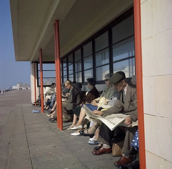 Middle-aged people in a beach shelter at the seaside