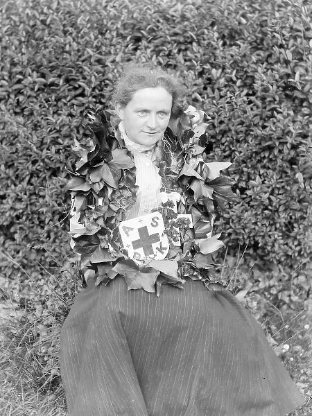 Middle aged woman with Red Cross wreath, Mid Wales