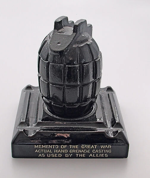 A Mills hand grenade made as an ink stand
