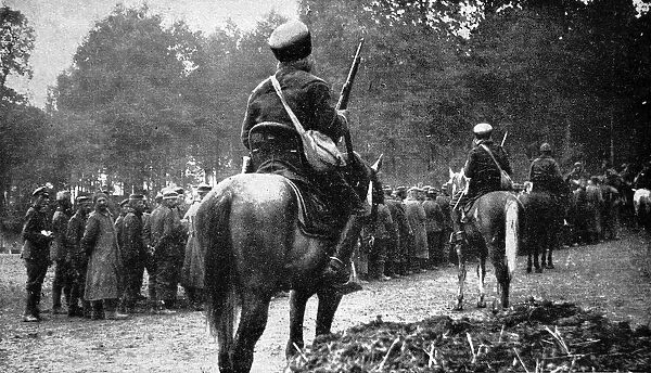 Mounted French Spahis guarding German prisoners; First World
