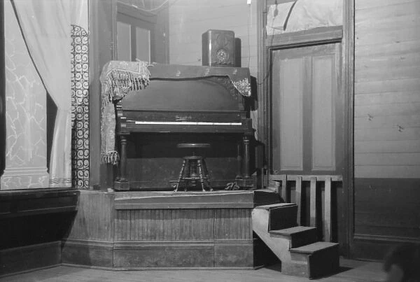 Piano on platform in auditorium, New Iberia, Louisiana