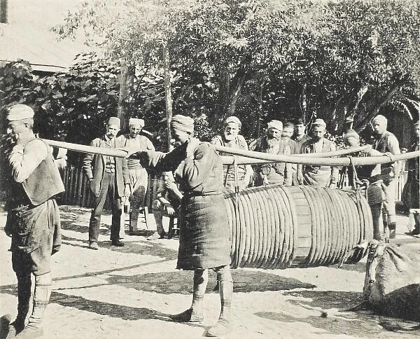 Porters carrying a large barrel on two long yolks