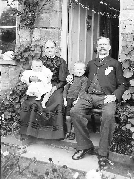 Proud grandparents with two children, Mid Wales