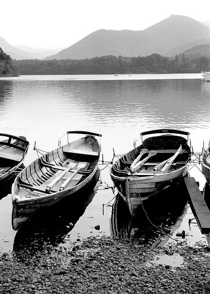 Rowing boats on a lake, Lake District, England