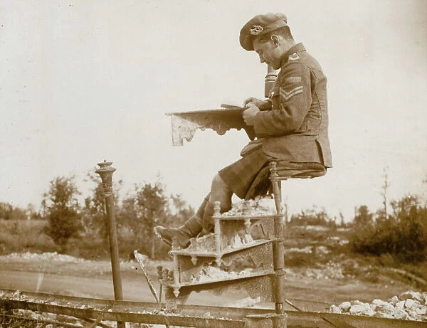 Scottish soldier writing home on a spiral staircase, WW1