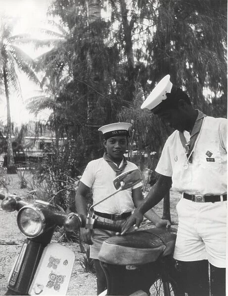 Sea scouts with moped, Gilbert Islands, Pacific