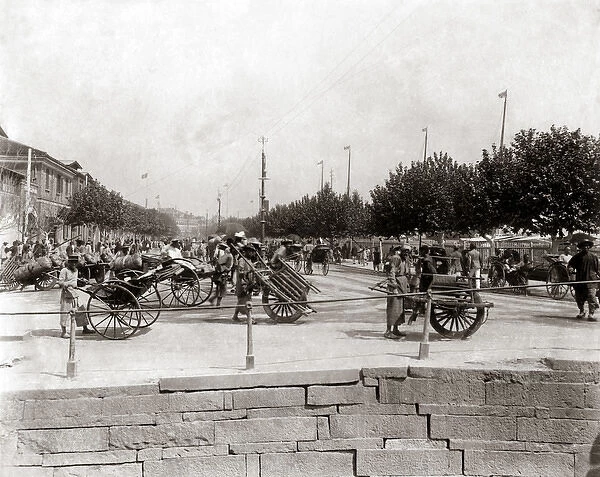 Shanghai, China circa 1890 - Wheelbarrows on The Bund