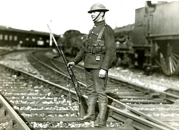 Soldier guarding line at Slough during railway strike