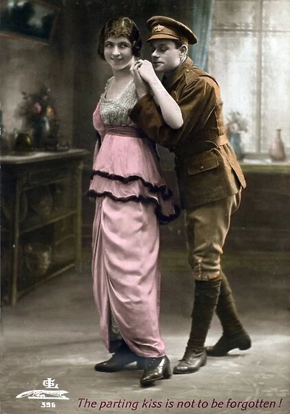 Soldier standing behind a young lady - Postcard