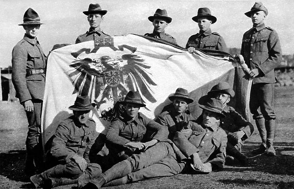 Soldiers from the New Zealand Expeditionary Force posed with the captured Imperial German Standard