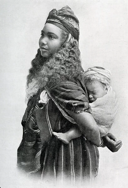 South Algeria woman carrying her baby on her back