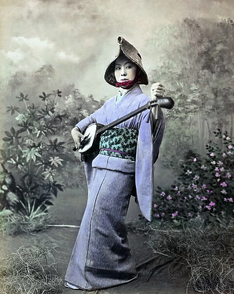 Street singer with shamisen, Japan