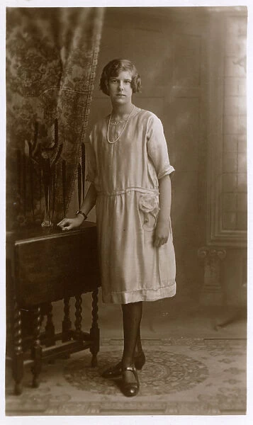 Studio Portrait of a woman in elegant shift dress