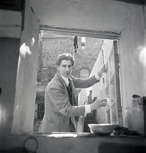 Unknown man at a window