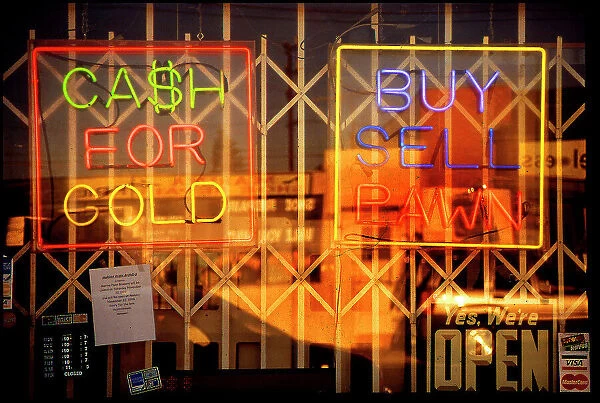 Window of Los Angeles pawn shop with neon