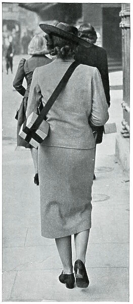 Woman carrying gas mask correctly, September 1939