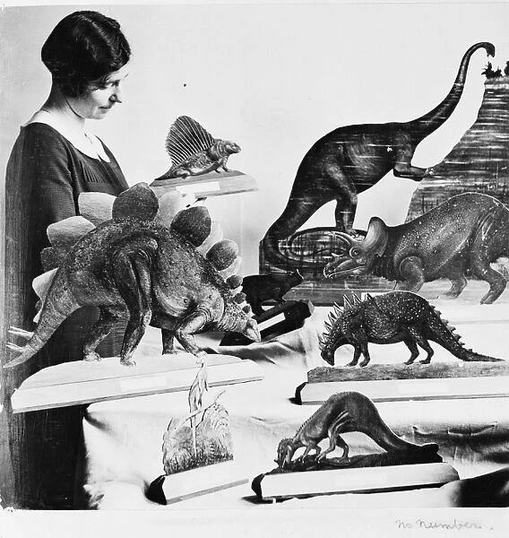 Woman with dinosaur models, 1926