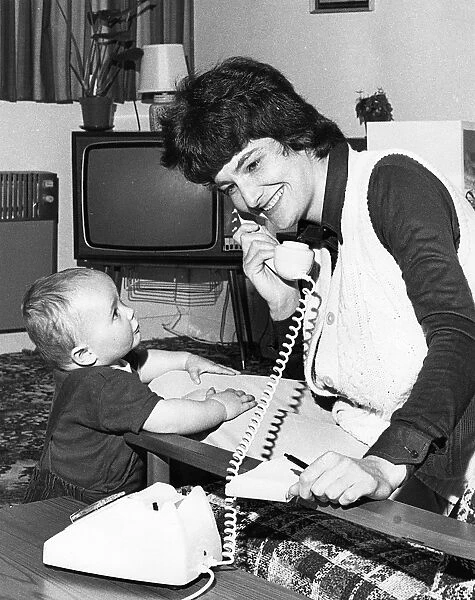 Woman on the phone, with toddler