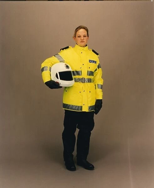 Woman police officer in reflective uniform, London